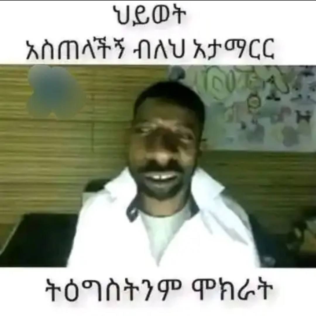 a man with a mustache and a white shirt